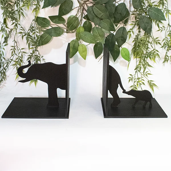 Soporte cuña para libros 4 Soporte cuña para libros elefantes en mdf pintado vista frontal sin uso